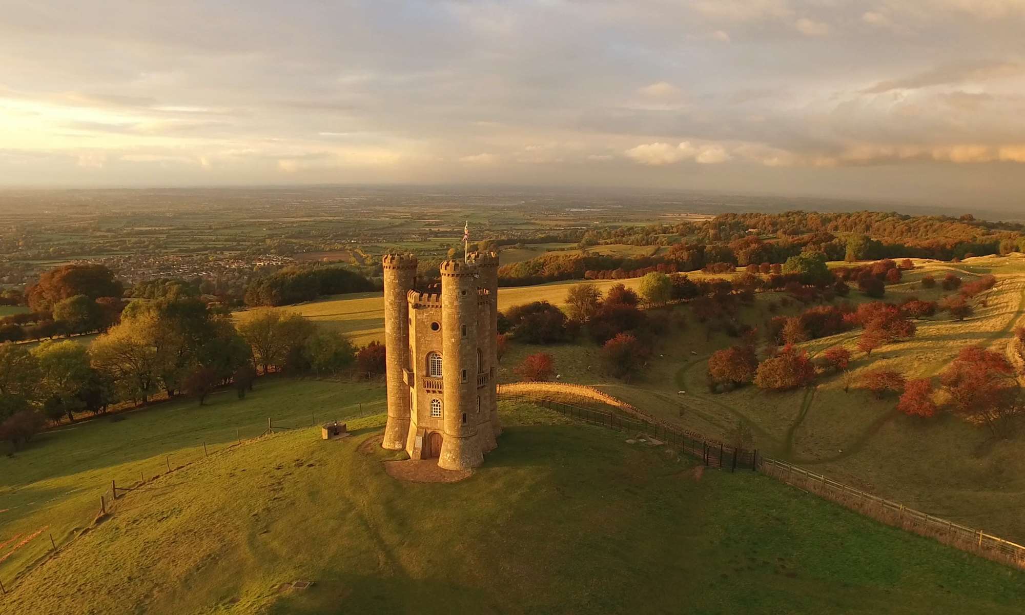 Aerial image of the Broadway Tower at sunset