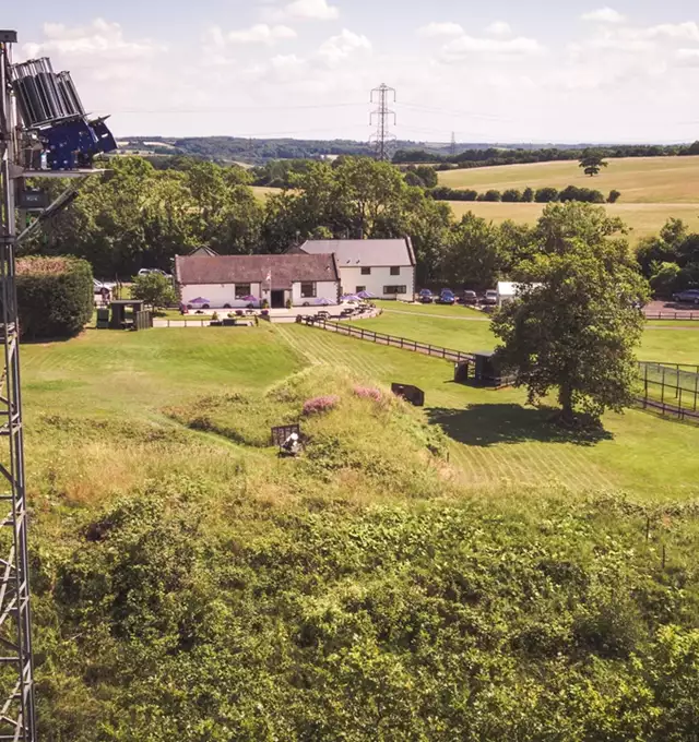 Aerial view of countryside buildings and fields