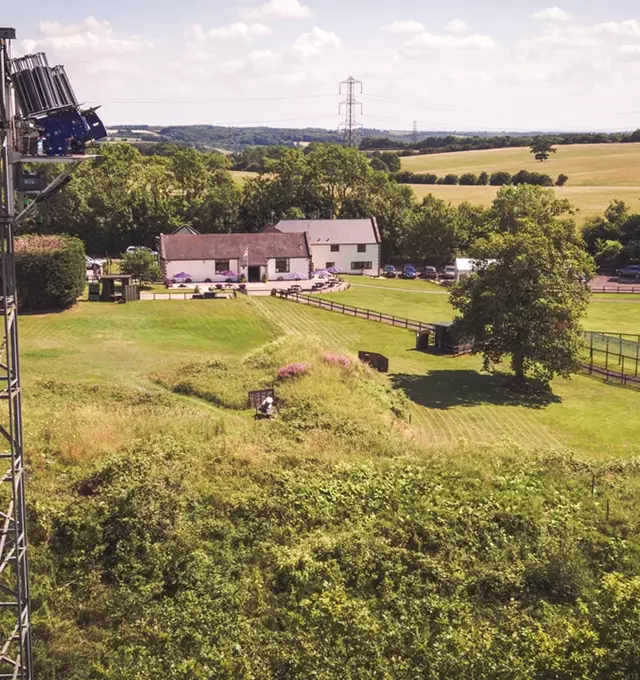 Aerial view of countryside buildings and fields
