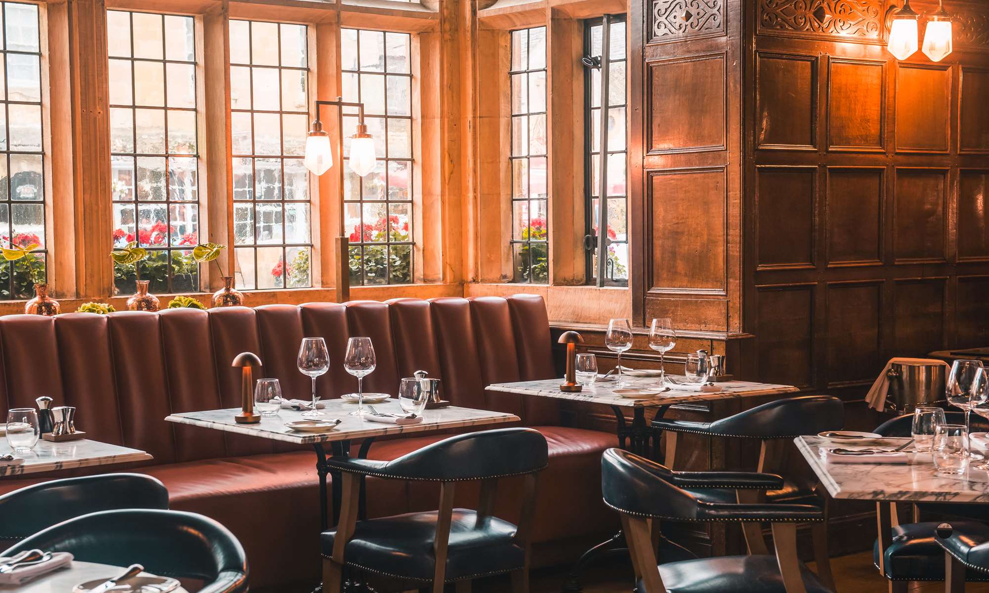 Restaurant seating area, with large windows and modern decor