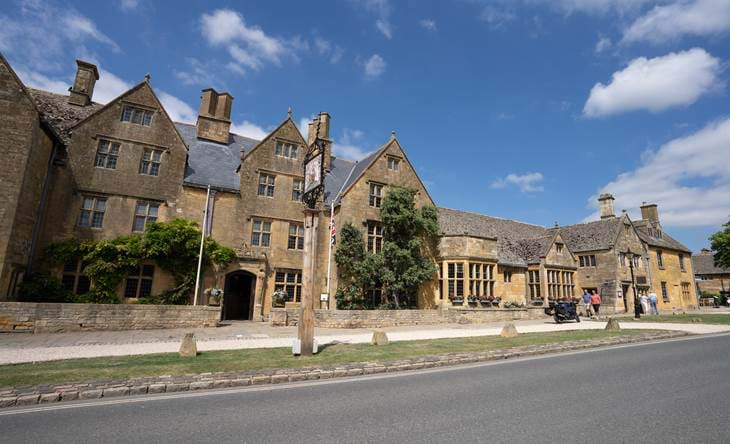 The Lygon Arms facade with blue skies