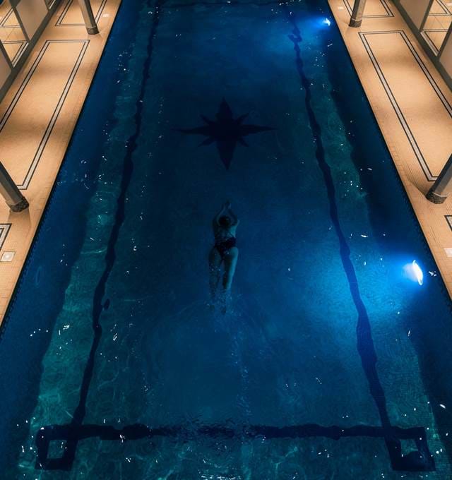 Woman Swimming In Lygon Arms Swimming Pool